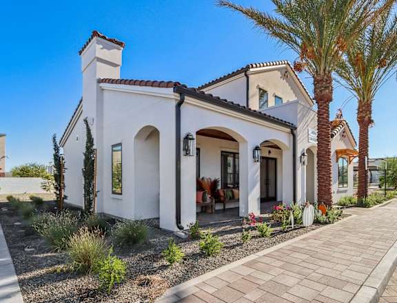 the exterior of a house with palm trees and a sidewalk at Stella Luxury Apartment Homes, Arizona, 85143