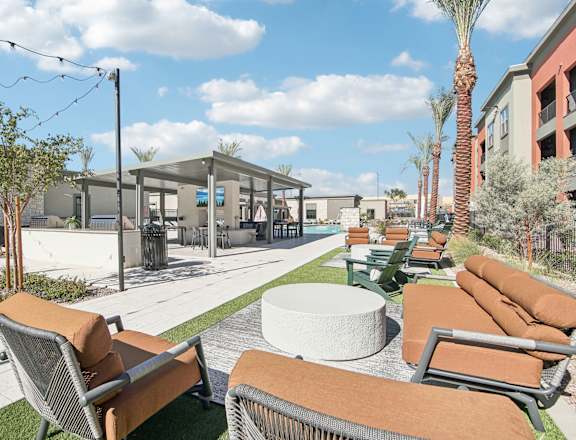 a lounge area with couches and chairs and tables at the resort at The Maddox Luxury Apartment Homes, Buckeye, AZ, 85326
