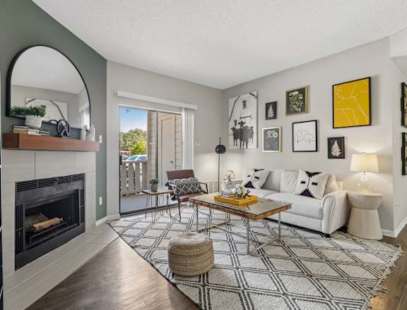 A living room with a fireplace and a couch.