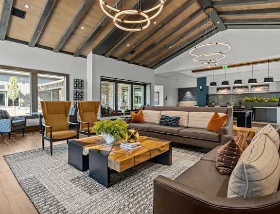 a living room with couches and chairs and a table
