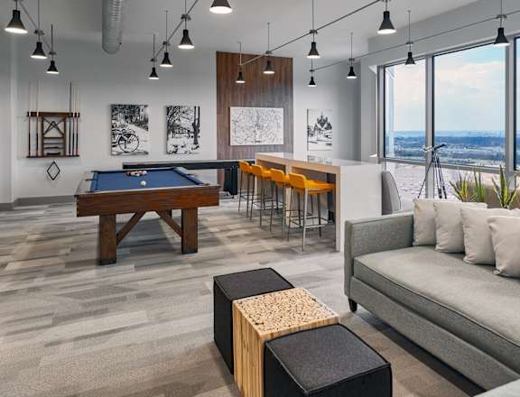 Living Room with Pool Table at The Oxford Apartments, Oxon Hill