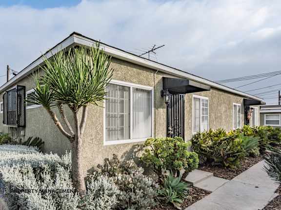 A house with a garden in front.