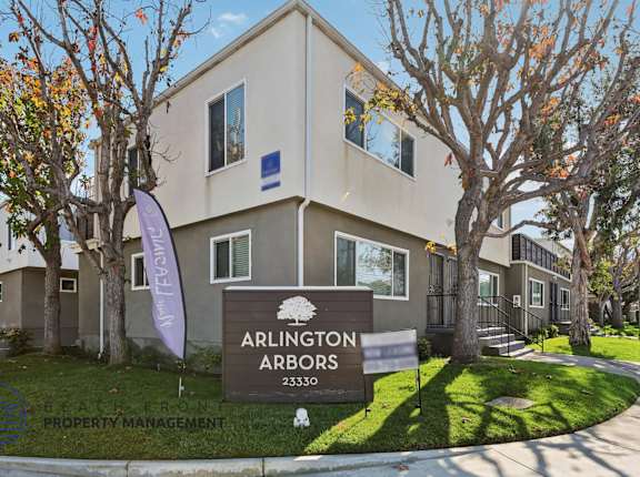 Arlington Apartors sign in front of a building.