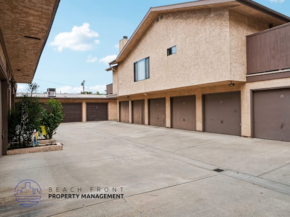 A building with a parking lot in front of it.