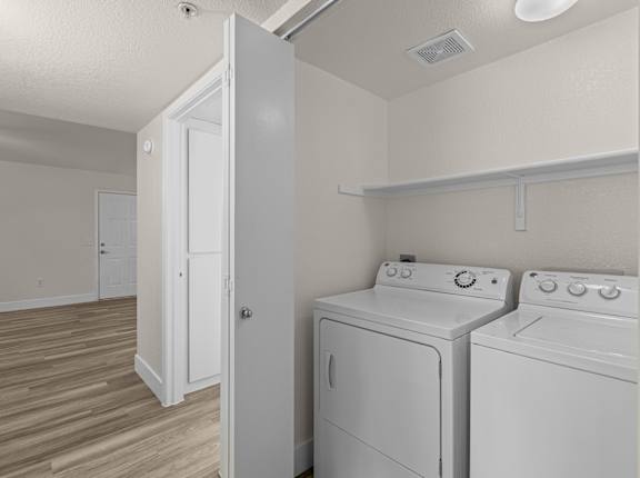 A laundry room with a washer and dryer.
