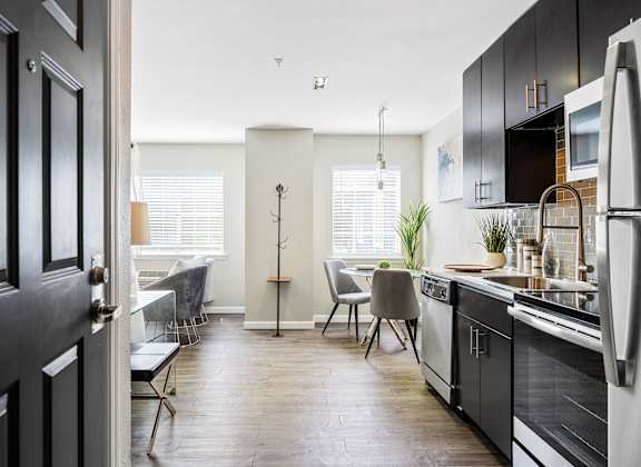 a kitchen and dining area in a 555 waverly unit