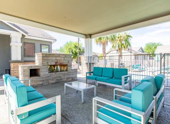 patio with couches and a fireplace at Villas on Olive in Peoria, AZ 85345