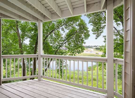 the view from the porch of a house overlooking a lake at Cityscape, St Louis Park, MN, 55416