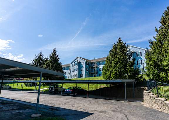 Covered parking and apartment buildings at Hunters Ridge in Kalamazoo, MI