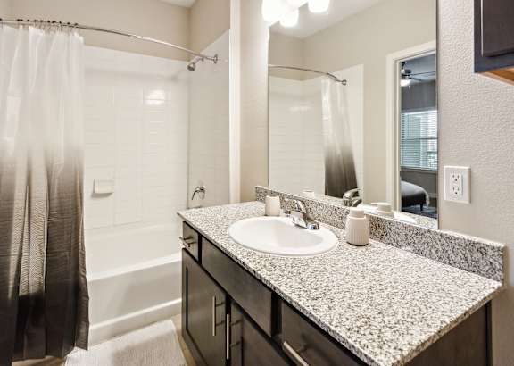 a bathroom with a toilet sink and bathtub