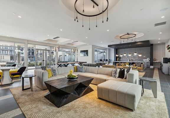 a living room with couches and chairs and a table