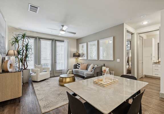 an open living room and dining room with a white table
