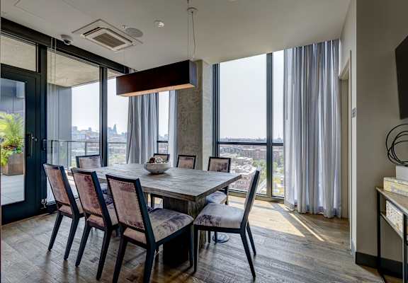 A modern dining room with a table set for four. at The Mason Apartments, Illinois, 60607
