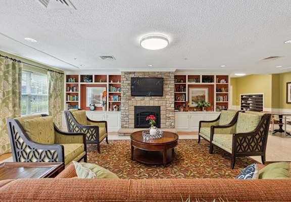 a living room filled with furniture and a fire place