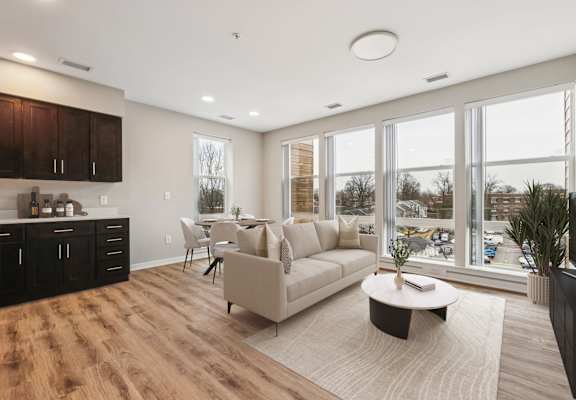 A modern living room with a large couch and a coffee table.