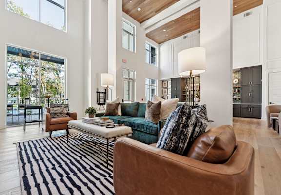 a living room with a couch and a rug