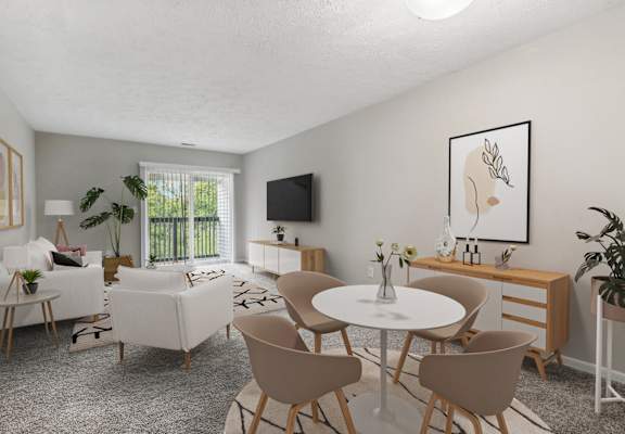 a living room with white furniture and a table and chairs