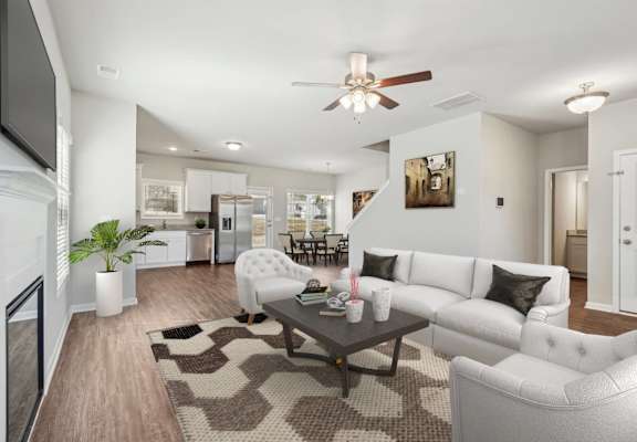 A modern living room with a white couch and a coffee table.
