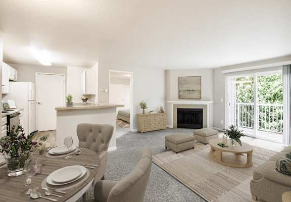 a living room with a table and chairs and a fireplace