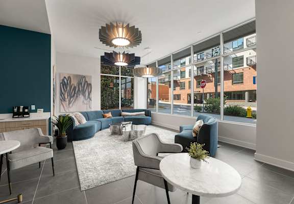 A modern living room with a large window overlooking a cityscape.
