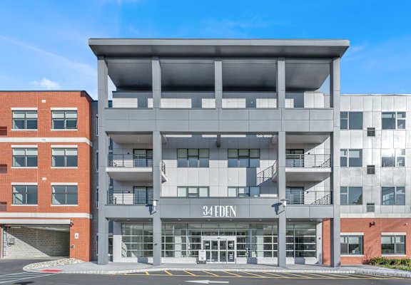A modern building with the number 34 EDEN on the front.