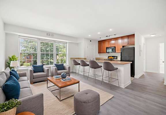 A living room with a grey sofa and a coffee table.