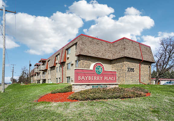 The front of a building with the name Bayberry Place on it.