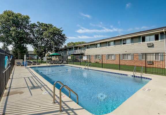 our apartments have a large pool and a building with a fence