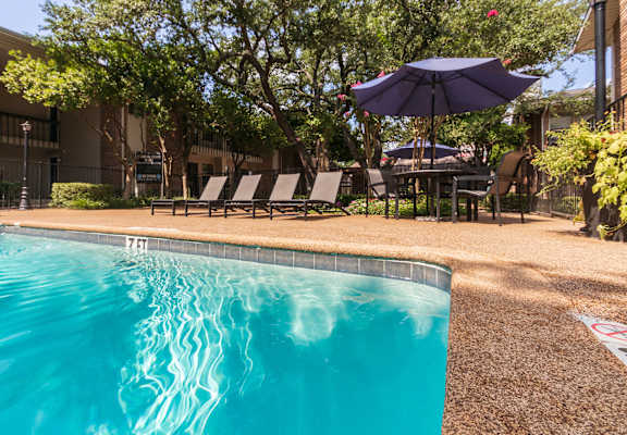 This is a photo of the pool area at Preston Park Apartments in Dallas, TX
