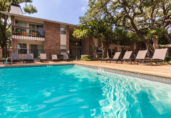 This is a photo of the pool area at Preston Park Apartments in Dallas, TX