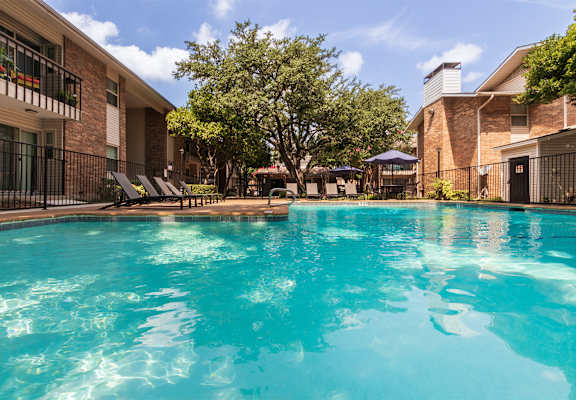 This is a photo of the pool area at Preston Park Apartments in Dallas, TX