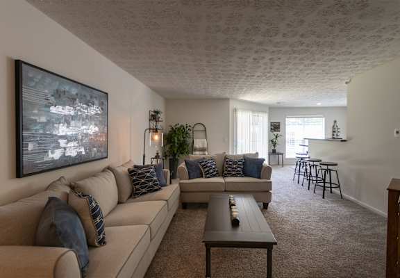 This is a photo of the living room of the 1100 square foot 2 bedroom Kettering floor plan at Washington Park Apartments in Centerville, OH.