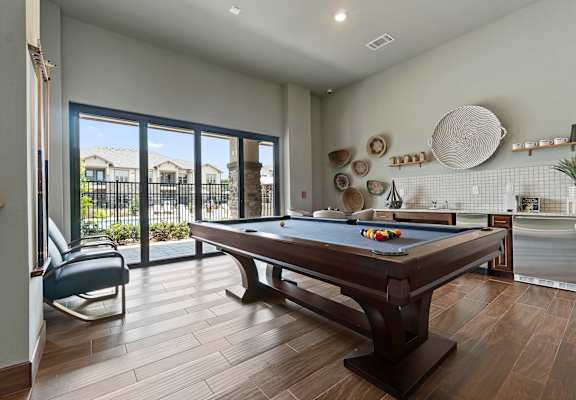 Resident lounge with pool table at Auberge of Tyler apartments in Tyler TX.
