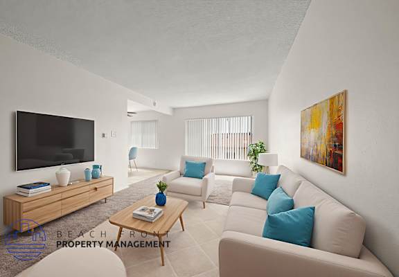 A living room with a television, sofas, and a coffee table.