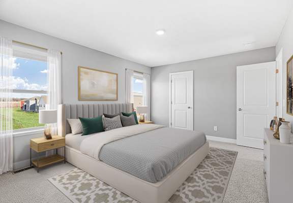A bedroom with a large bed and a painting on the wall.