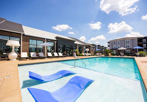 A large swimming pool with a blue wave design in the middle.