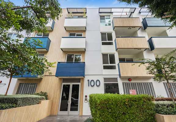 A modern building with the number 100 on the front.