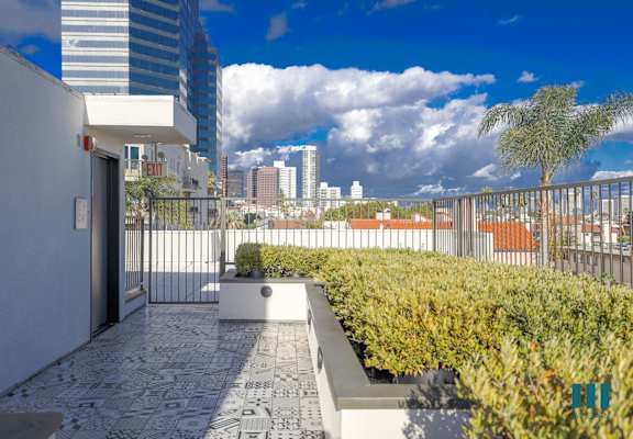 the view of the city from the balcony of a condo