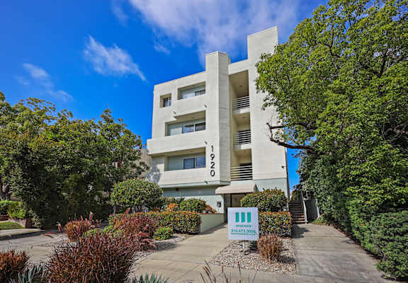 A modern building with a clear blue sky in the background.