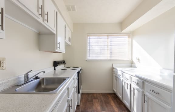 This is a photo of the kitchen in the 899 square foot, 2 bedroom, 1 and a half bath apartment at Blue Grass Manor Apartments in Erlanger, KY.