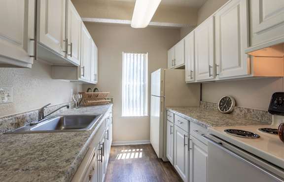 This is a photo of the kitchen in the 965 square foot 2 bedroom, 2 bath  apartment at Harvard Square Apartments, in Dallas, TX.