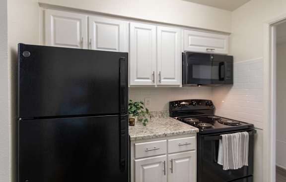 Kitchen cabinets at Preston Park Apartments, Dallas, TX, 75240