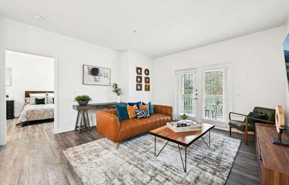 Living room with brown leather couch and coffee table
