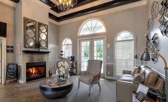 a living room with a fireplace and a couch