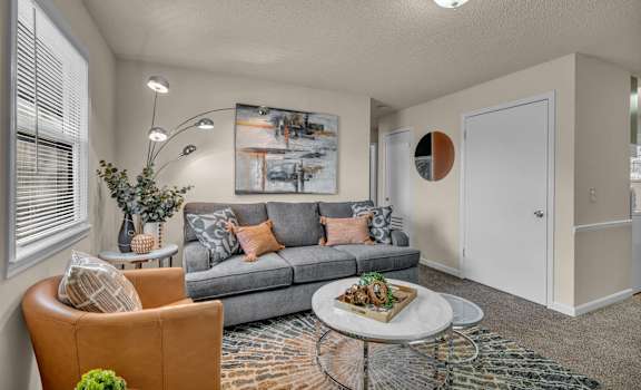 a living room with a couch and a coffee table