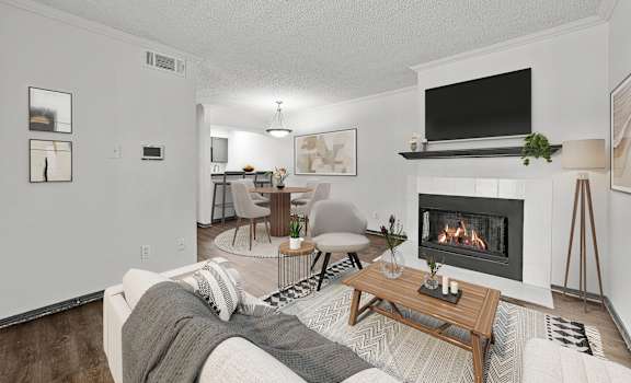 A living room with a fireplace and a couch.