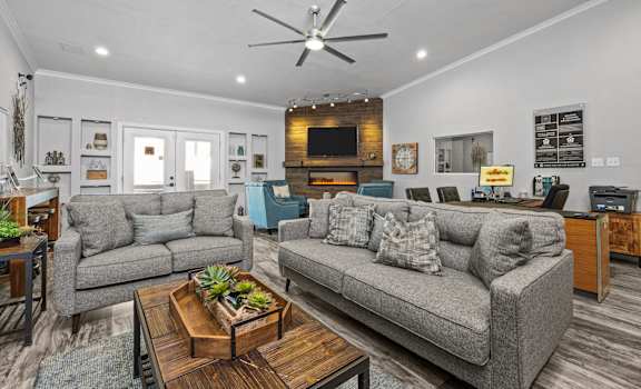 a living room with couches and a coffee table