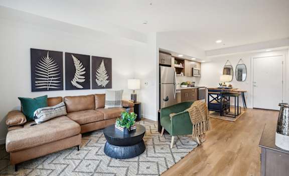 a living room with a couch and a table at The Mill on Maple Apartments, Oregon City, OR 97045