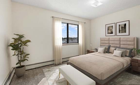 a bedroom with a bed and a window