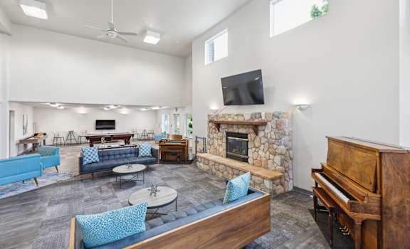 a living room with a couch and a table and a television